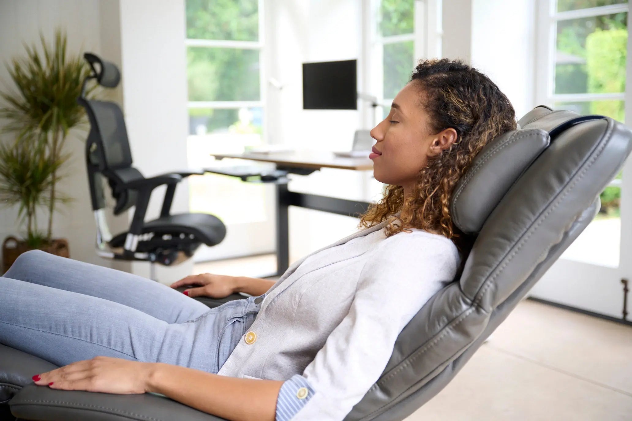 Woman reclining on a zero gravity chair