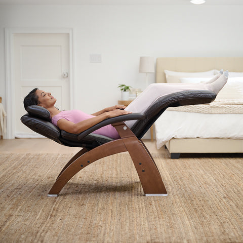 A woman in the zero gravity position on a Perfect Chair Recliner by Human Touch.