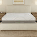 A front view of the GhostBed Massage 12" Hybrid Mattress in a bedroom setting. 