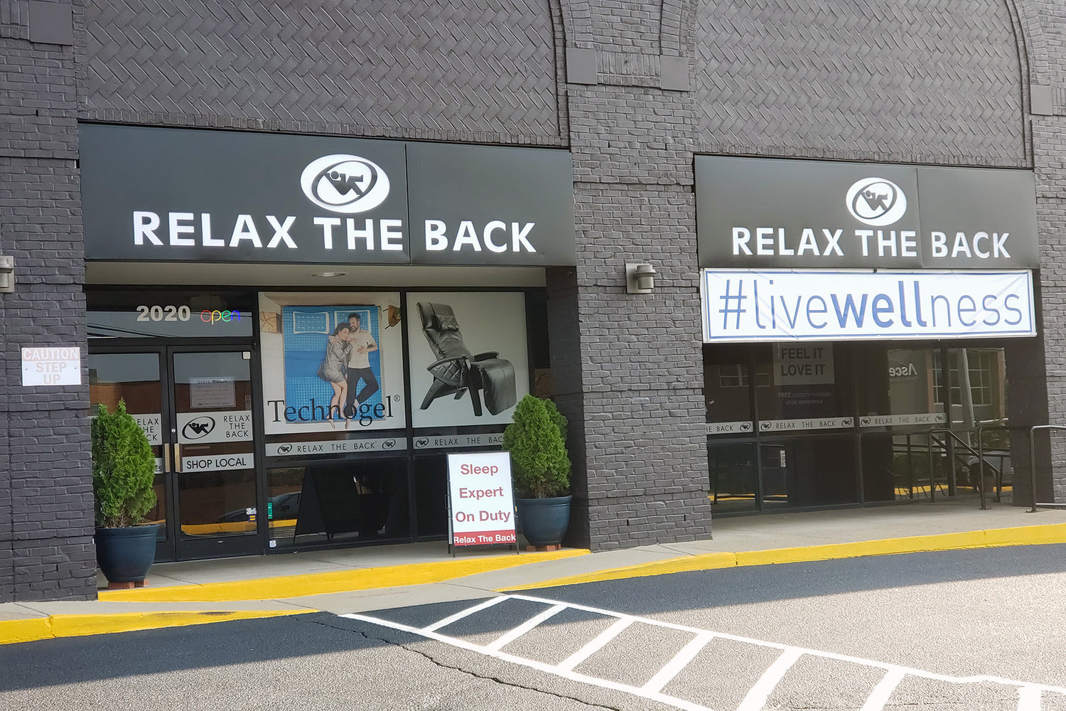Storefront with 'Relax the Back' branding and wellness message.