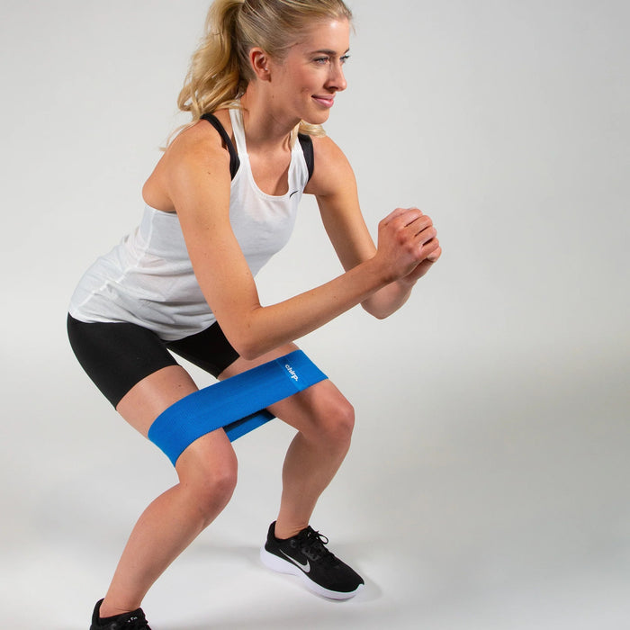 A woman using the blue Chirp resistance band