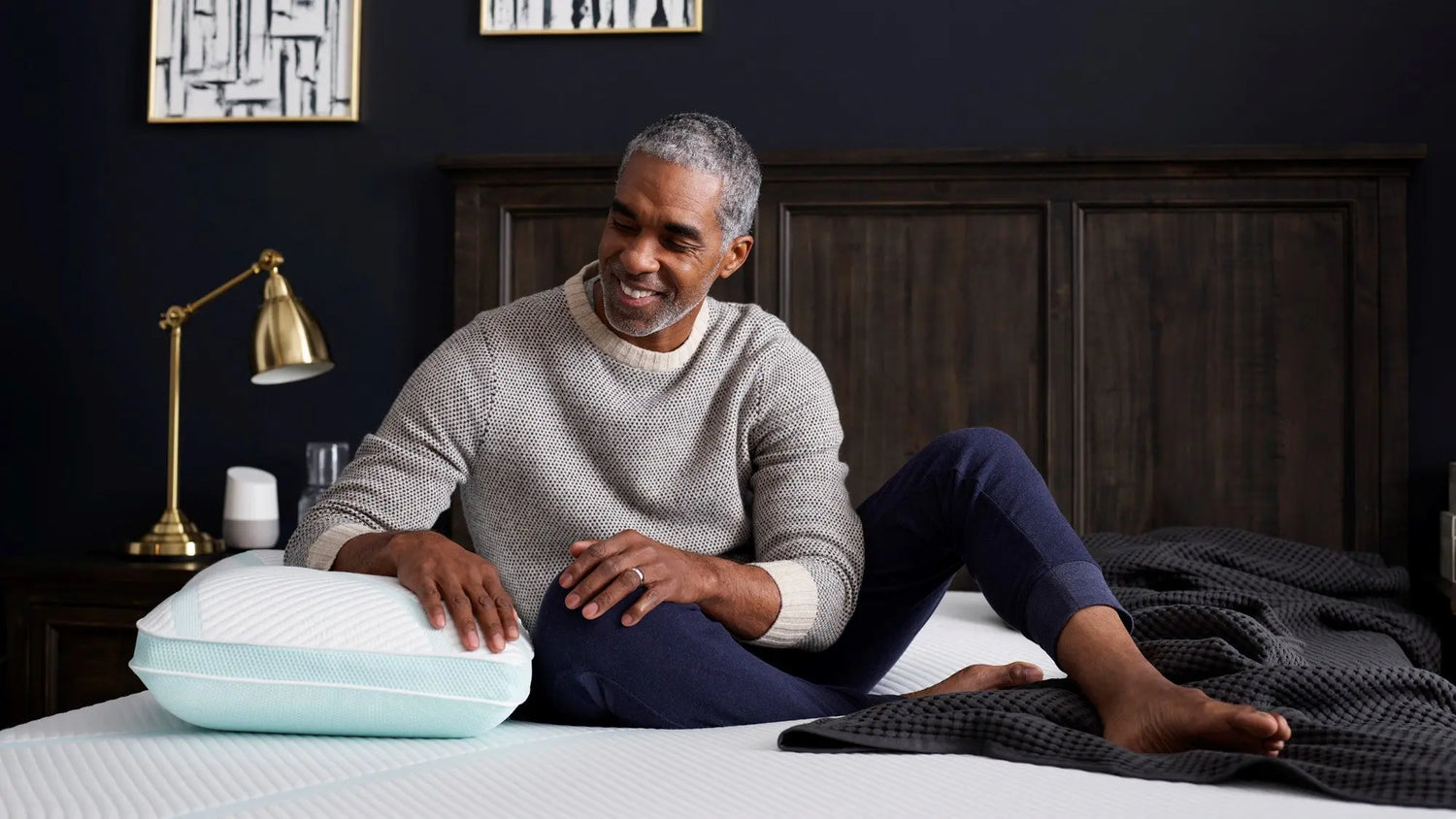 Man leaning on a Tempur Pedic pillow 