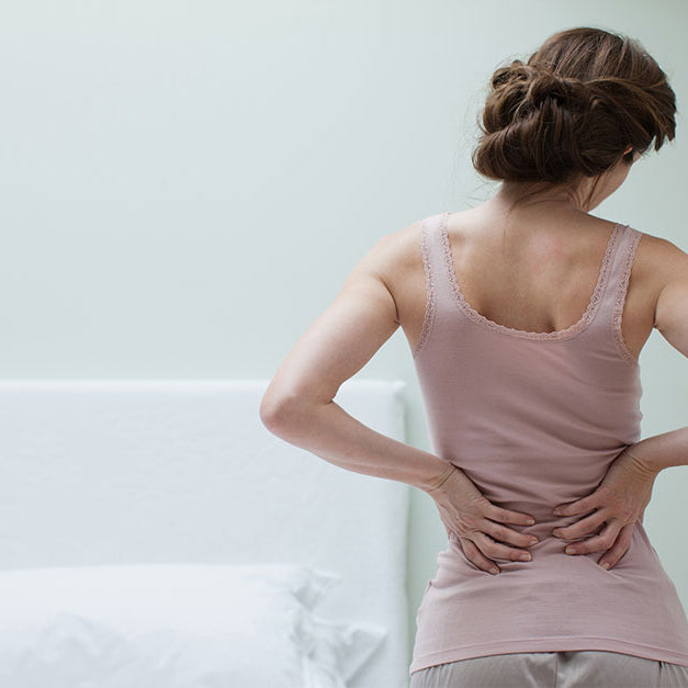Woman in back pain