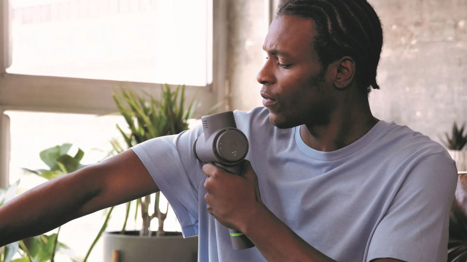 Man using the Hypervolt 2 Massager