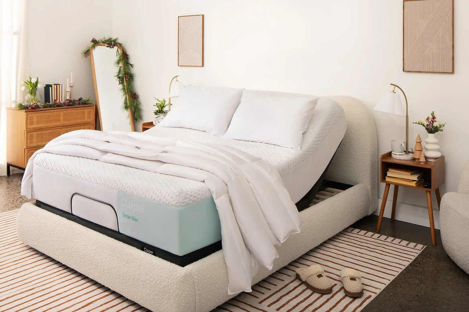 Casper Snow Max mattress sitting on an adjustable base in a bedroom