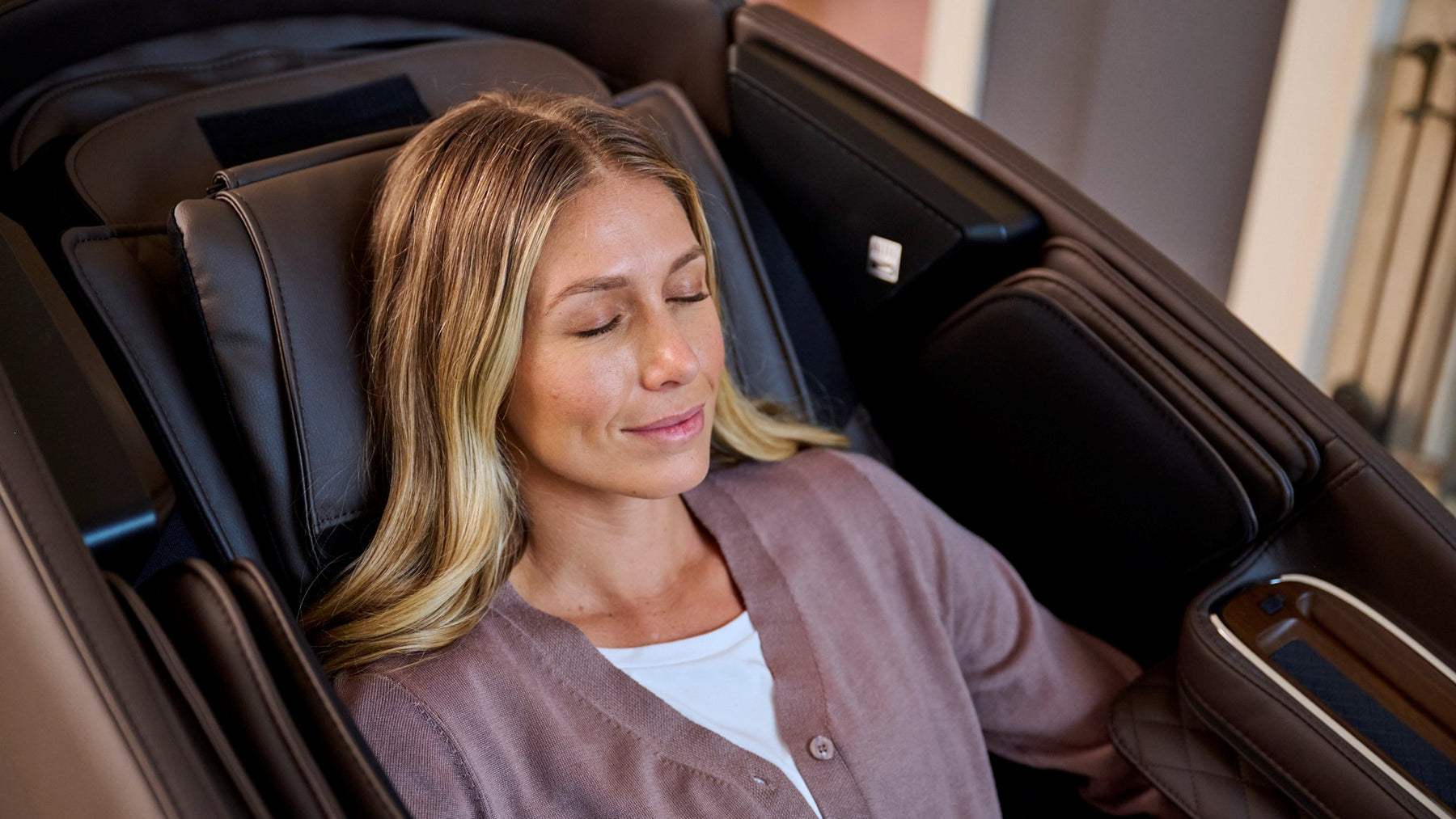 EveryBody Deserves a Massage Week - Woman sitting in a massage chair