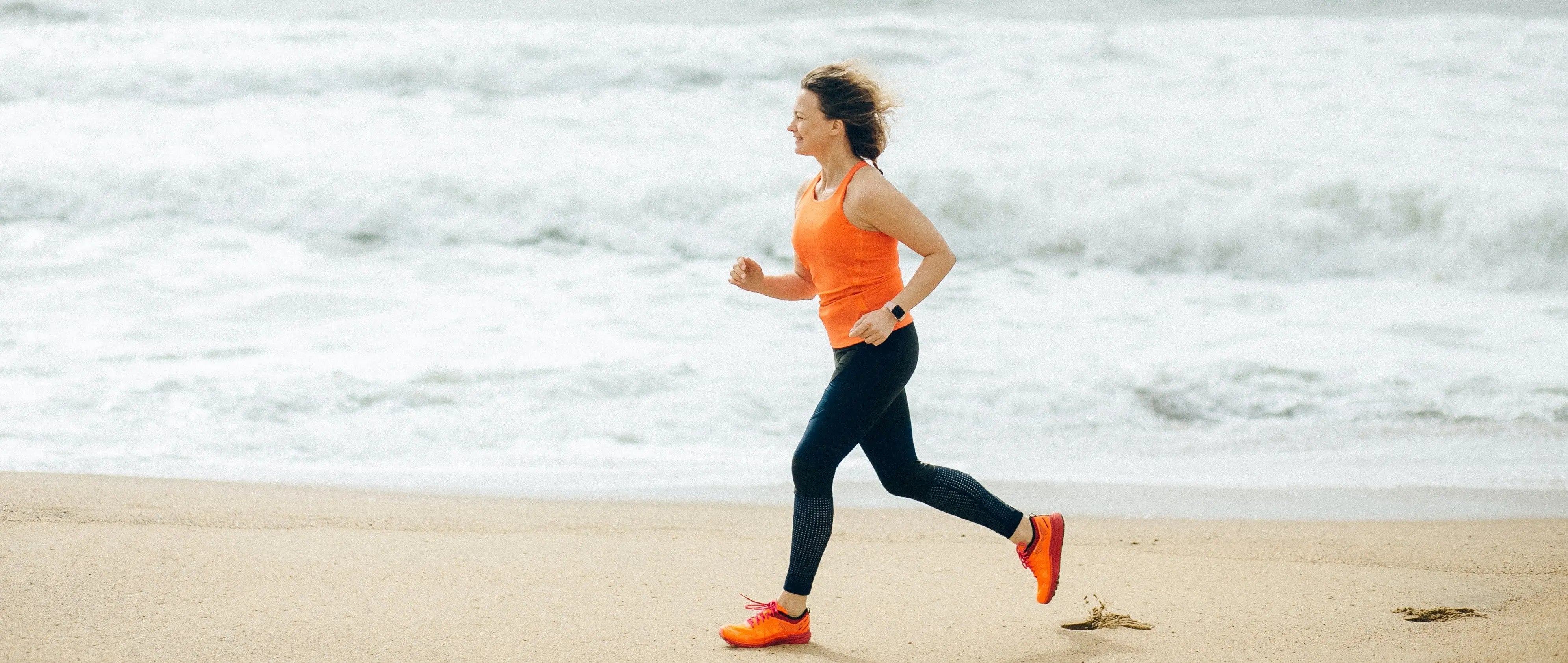 Woman running at the beach