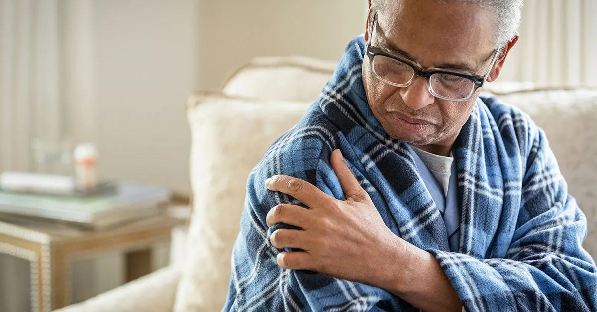 Man holding his shoulder