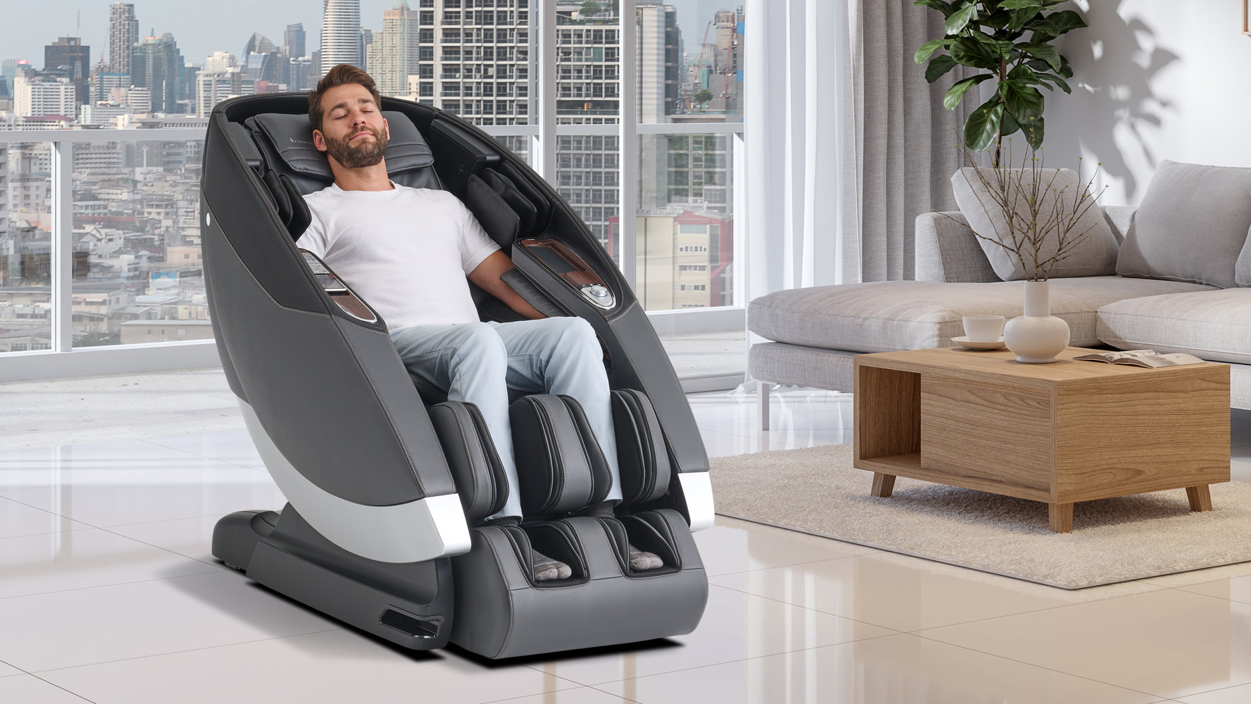 Man sitting in the Super Novo 2.0 Massage Chair by Human Touch in a living room setting
