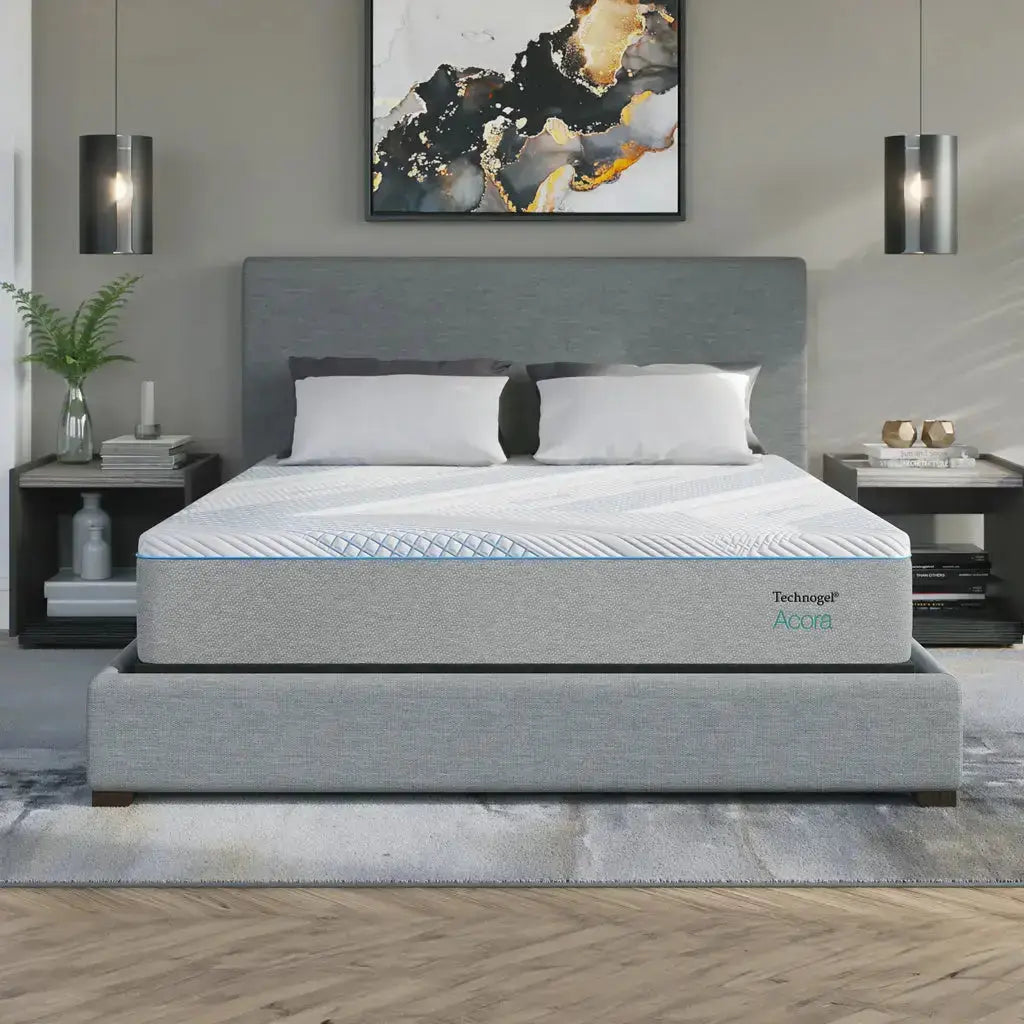 Gray mattress with 'Technogel' branding on a bed in a modern bedroom setting.