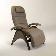 A modern high-back recliner chair with padded taupe-beige upholstery and a dark wood curved base, shown on a plain light gray studio background.