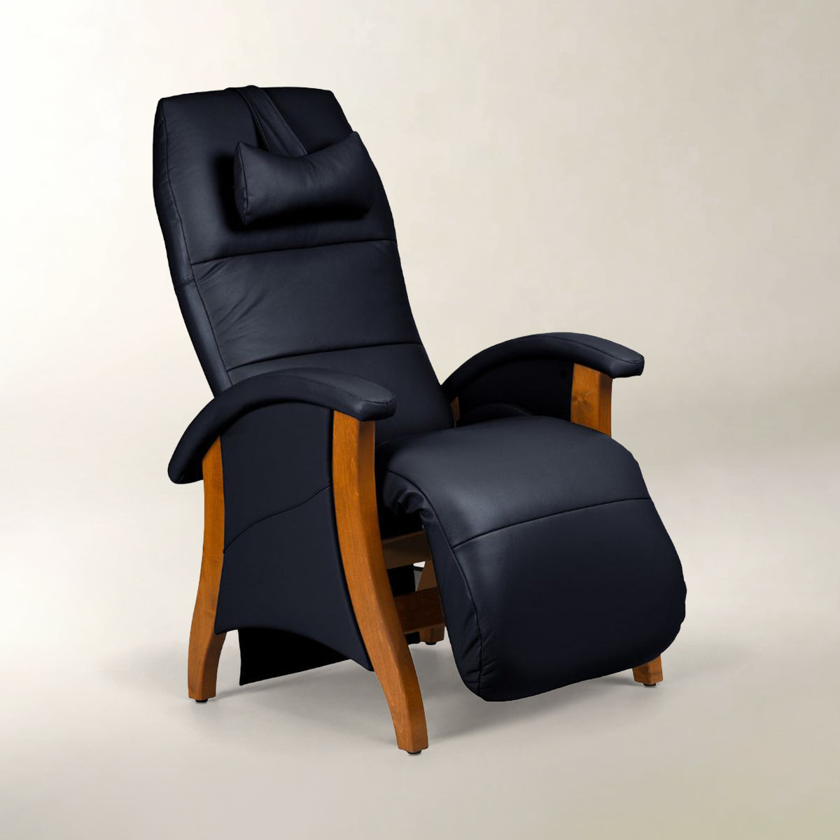 A high-back recliner chair upholstered in dark navy blue leather with natural wood arms and legs, shown on a neutral light beige studio background.