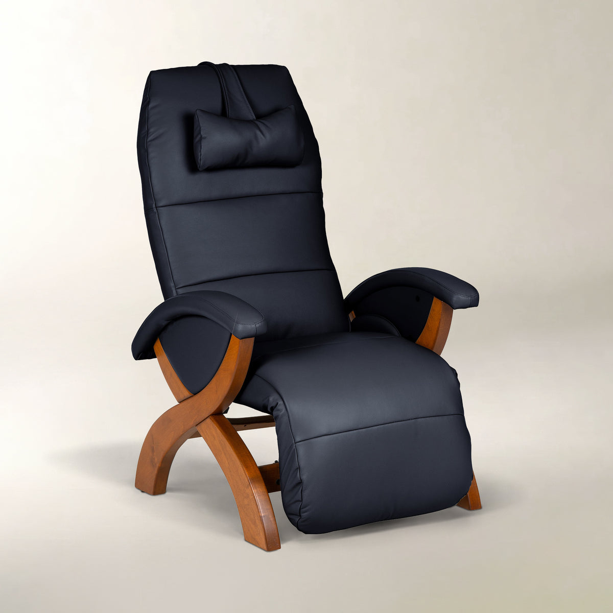 A dark navy blue padded recliner chair with curved wooden legs, shown on a plain light beige studio background.