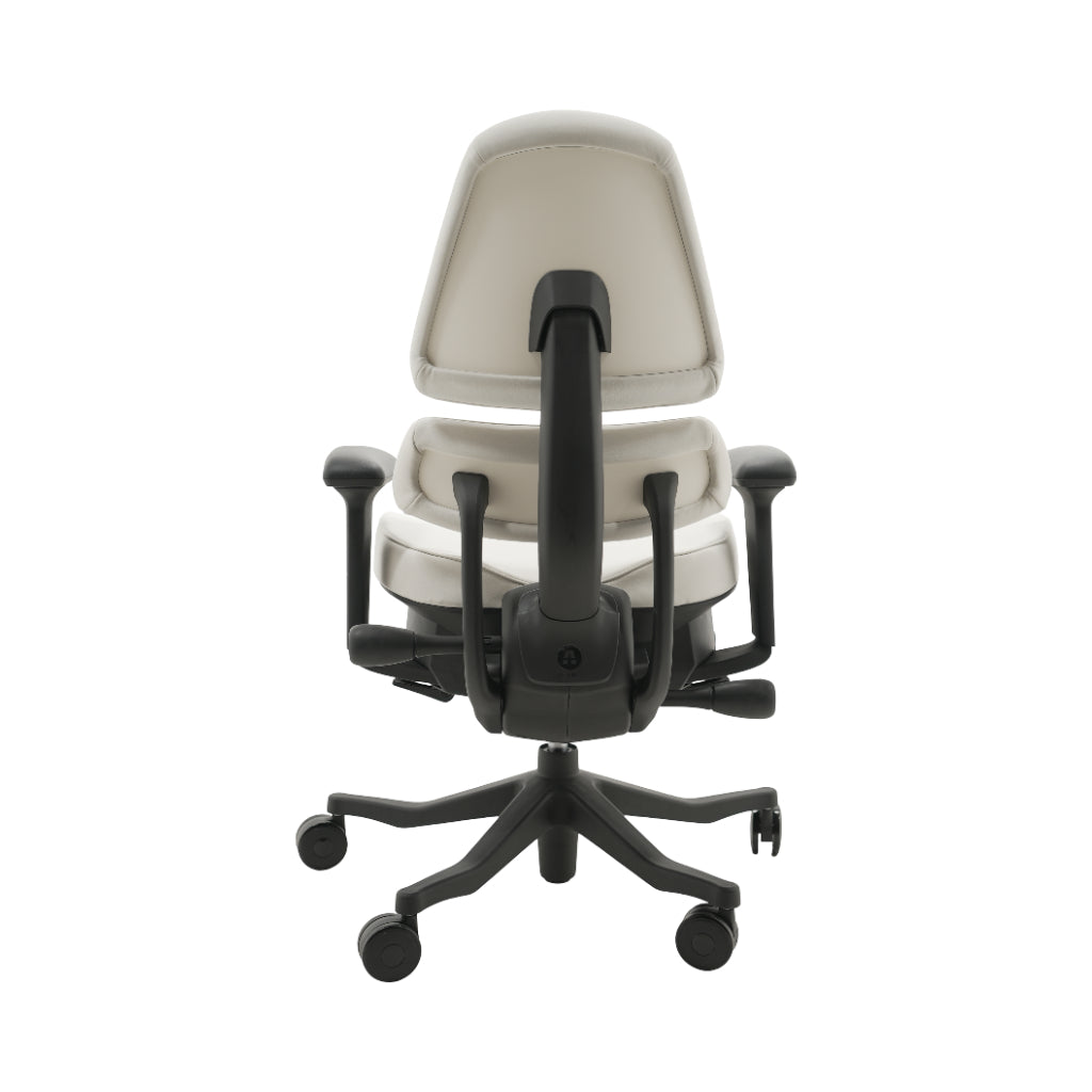 An ergonomic office chair with a high back, adjustable armrests, and a four-wheel base, shown from a rear angle on a white background.
