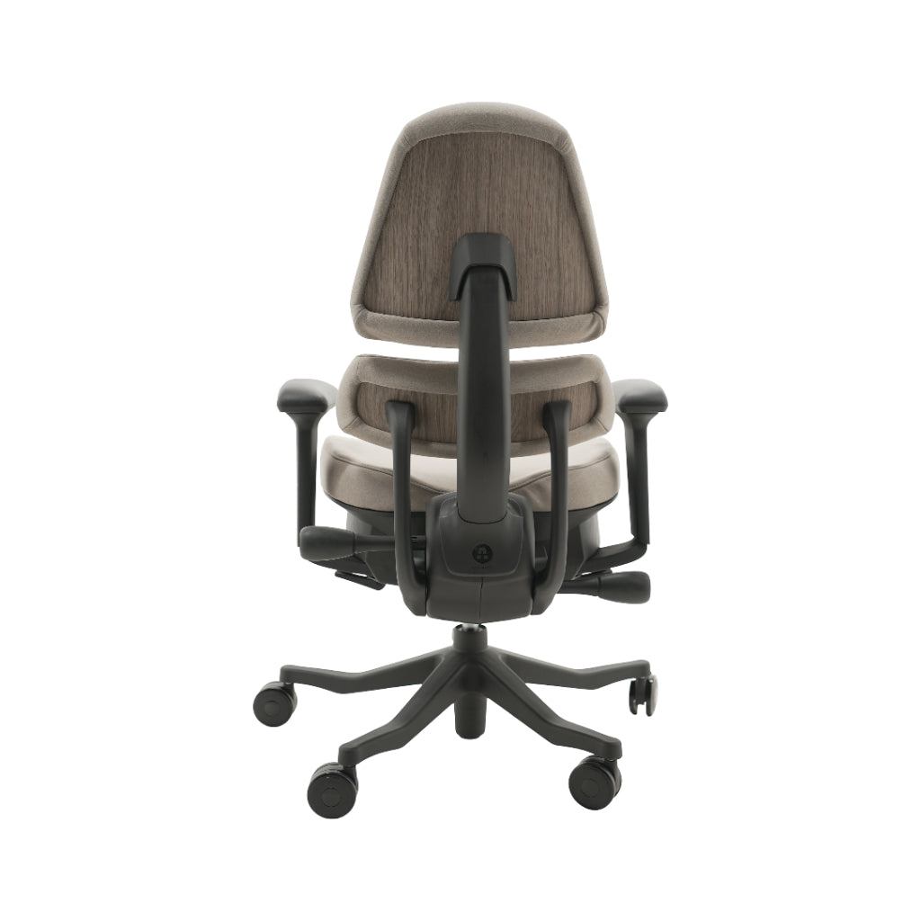 An ergonomic office chair with a high back, adjustable armrests, and a four-wheel base, shown from a rear angle on a white background.