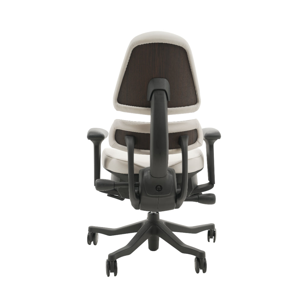 An ergonomic office chair with a high back, adjustable armrests, and a four-wheel base, shown from a rear angle on a white background.