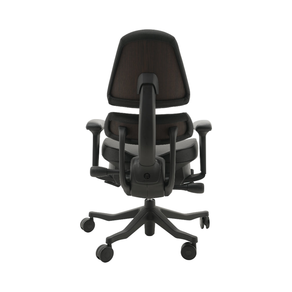 An ergonomic office chair with a high back, adjustable armrests, and a four-wheel base, shown from a rear angle on a white background.