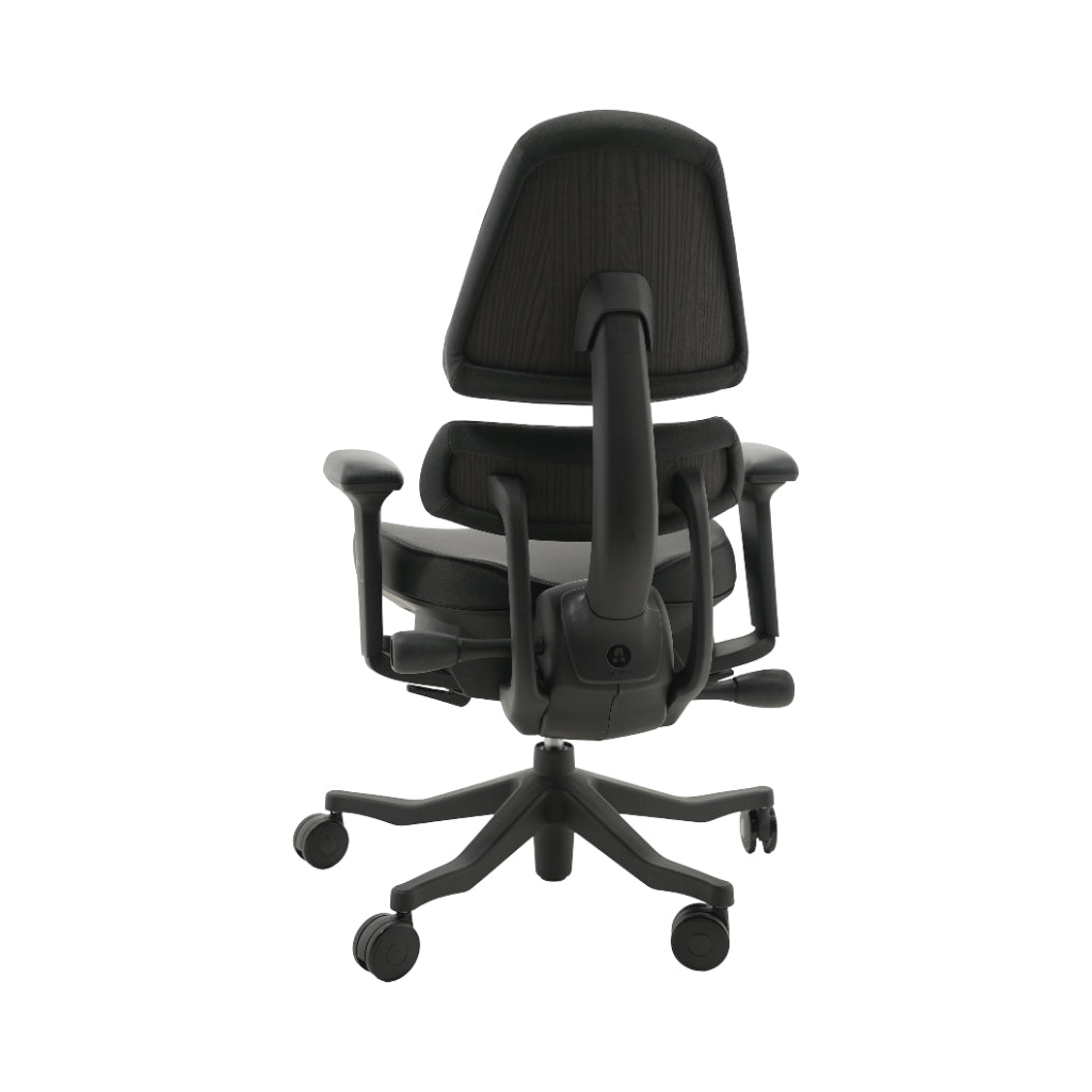 An ergonomic office chair with a high back, adjustable armrests, and a four-wheel base, shown from a rear angle on a white background.