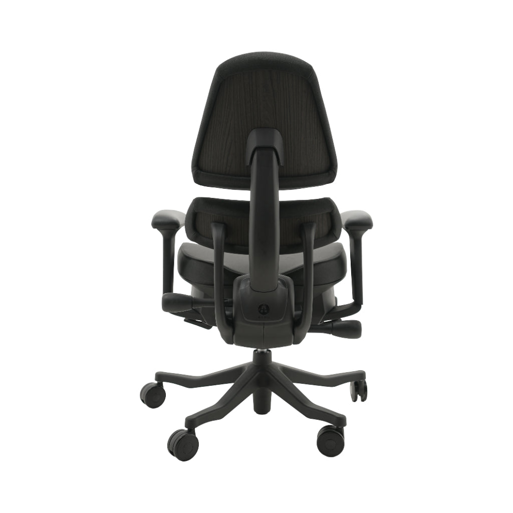 An ergonomic office chair with a high back, adjustable armrests, and a four-wheel base, shown from a rear angle on a white background.