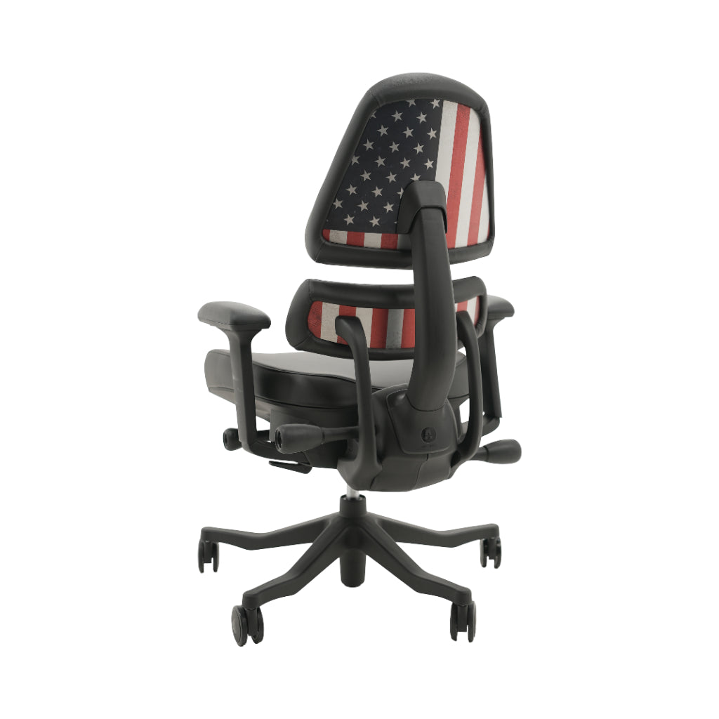 An ergonomic office chair with a high back, adjustable armrests, and a four-wheel base, shown from a rear angle on a white background.