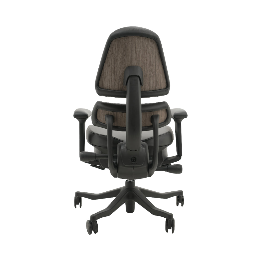An ergonomic office chair with a high back, adjustable armrests, and a four-wheel base, shown from a rear angle on a white background.