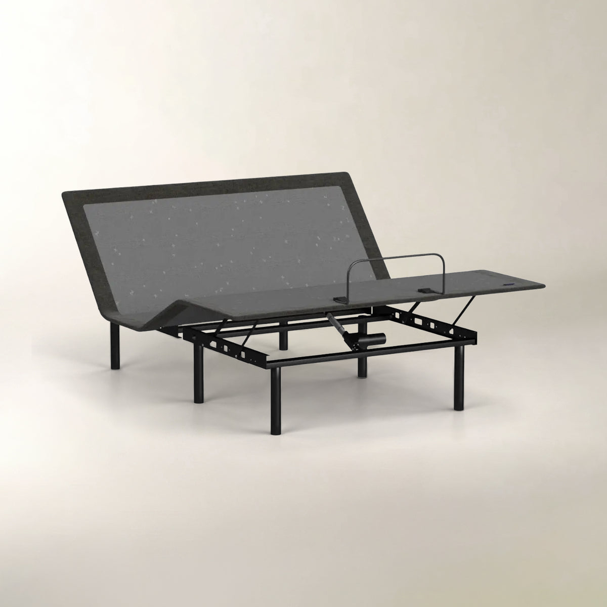 An adjustable electric bed frame with a black metal frame, featuring a dark gray textured mattress topper and a flat headboard panel, shown on a neutral light gray background.
