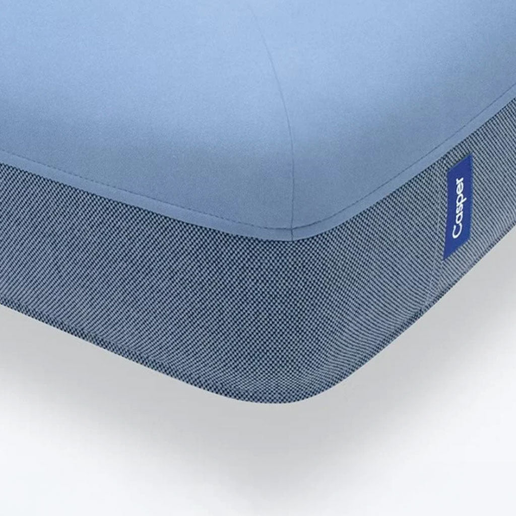 Close up the Casper blue dog bed on a white background