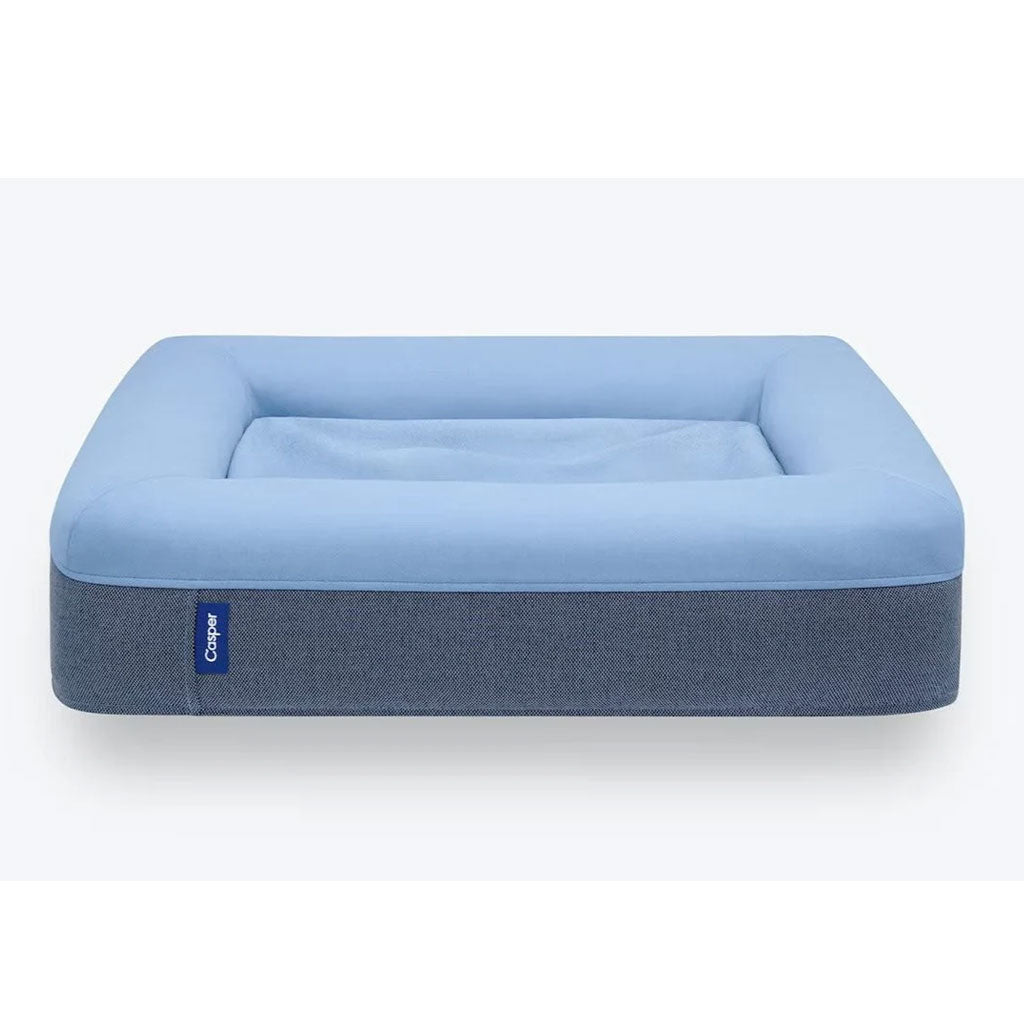 Blue pet bed with a gray base on a white background
