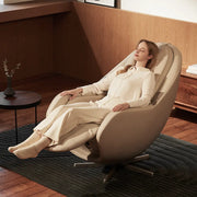 Woman relaxing in a modern massage chair in a stylish room.
