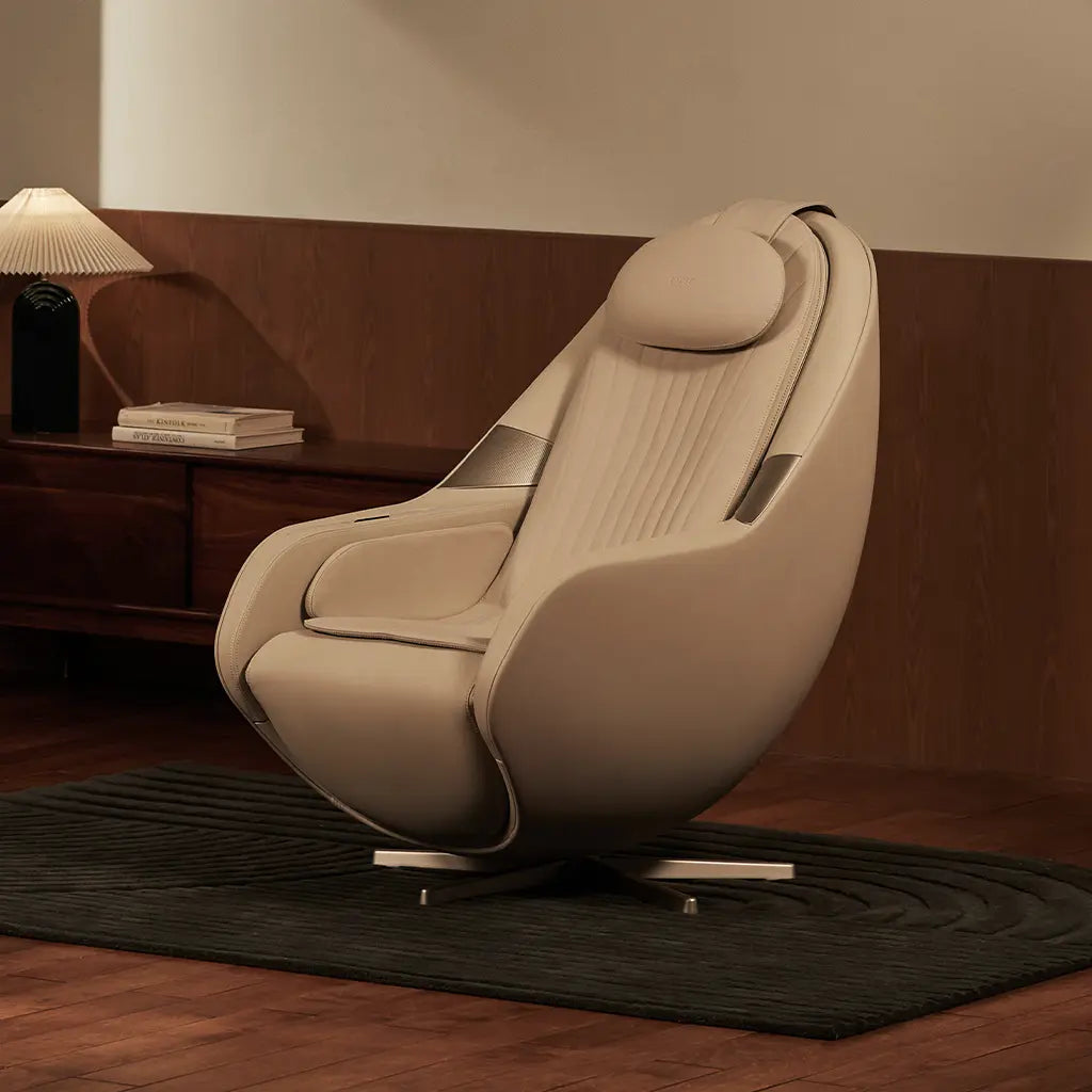Beige massage chair in a room with wooden floor and wall.