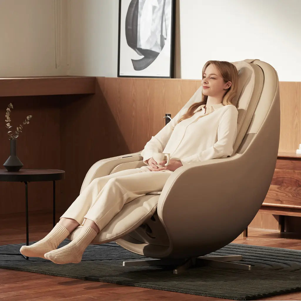 Woman relaxing in a modern massage chair in a stylish room.
