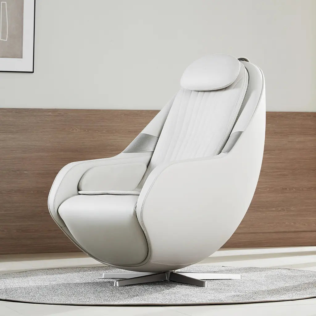 Modern white lounge chair in a room with wooden paneling and a framed picture.