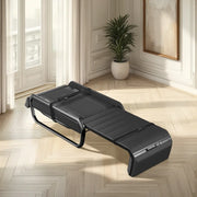 Ceragem V6 Thermal Massage Bed in a room setting with light wood floors, a plant in a neutral pot, white walls, and an abstract painting in a wood frame on the wall.