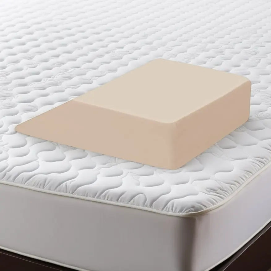 ContourSleep Leg Wedge shown on a mattress.