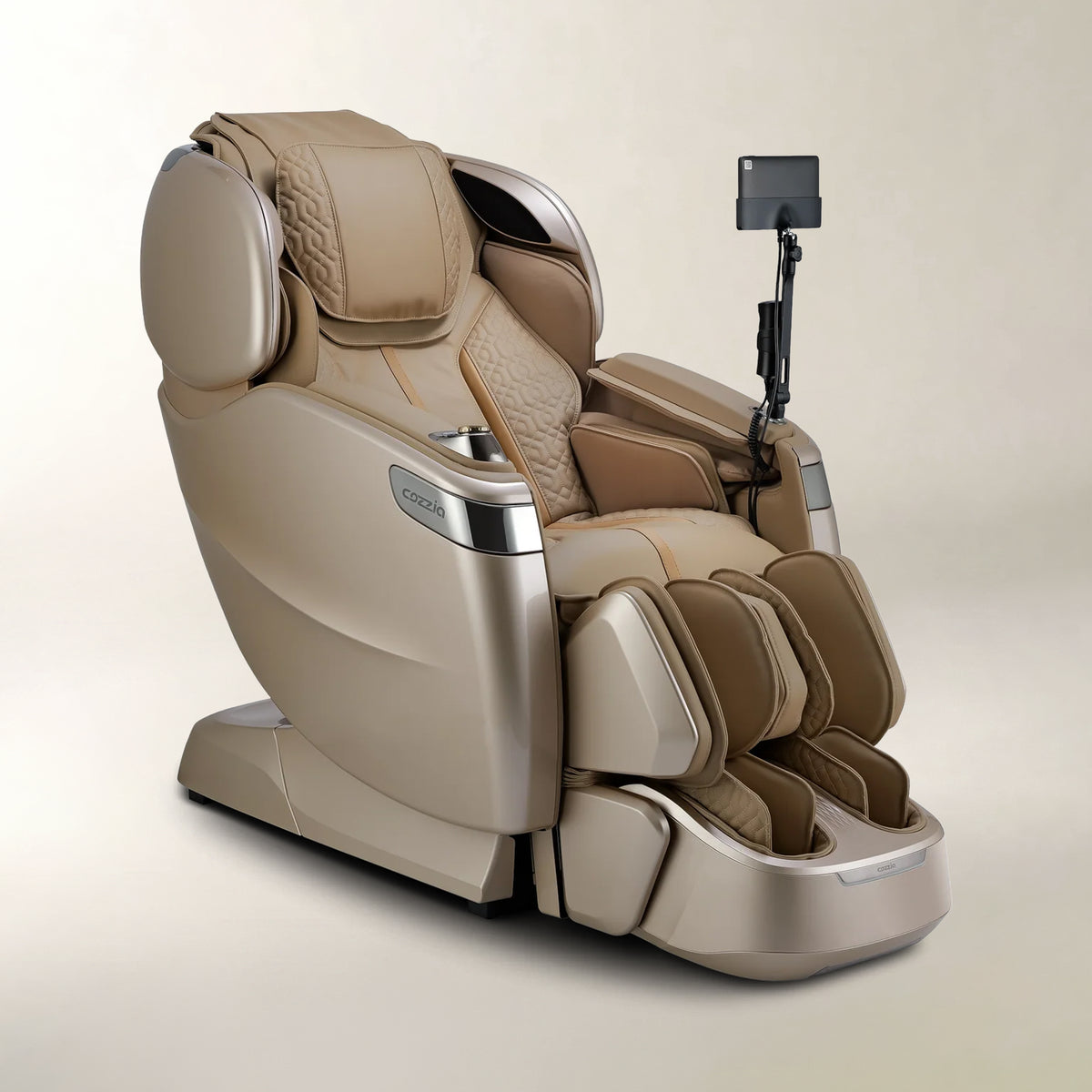 A modern beige and brown massage chair with a foot bath tray and a mounted remote control, photographed on a clean, light beige studio background.