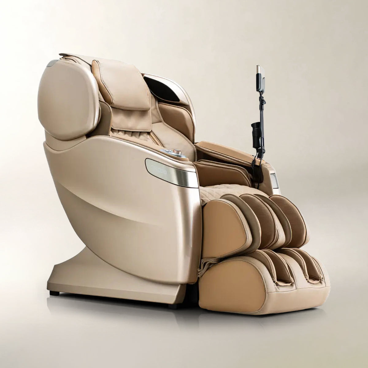 A luxury beige massage chair with an attached foot massager, shown on a neutral light beige background.