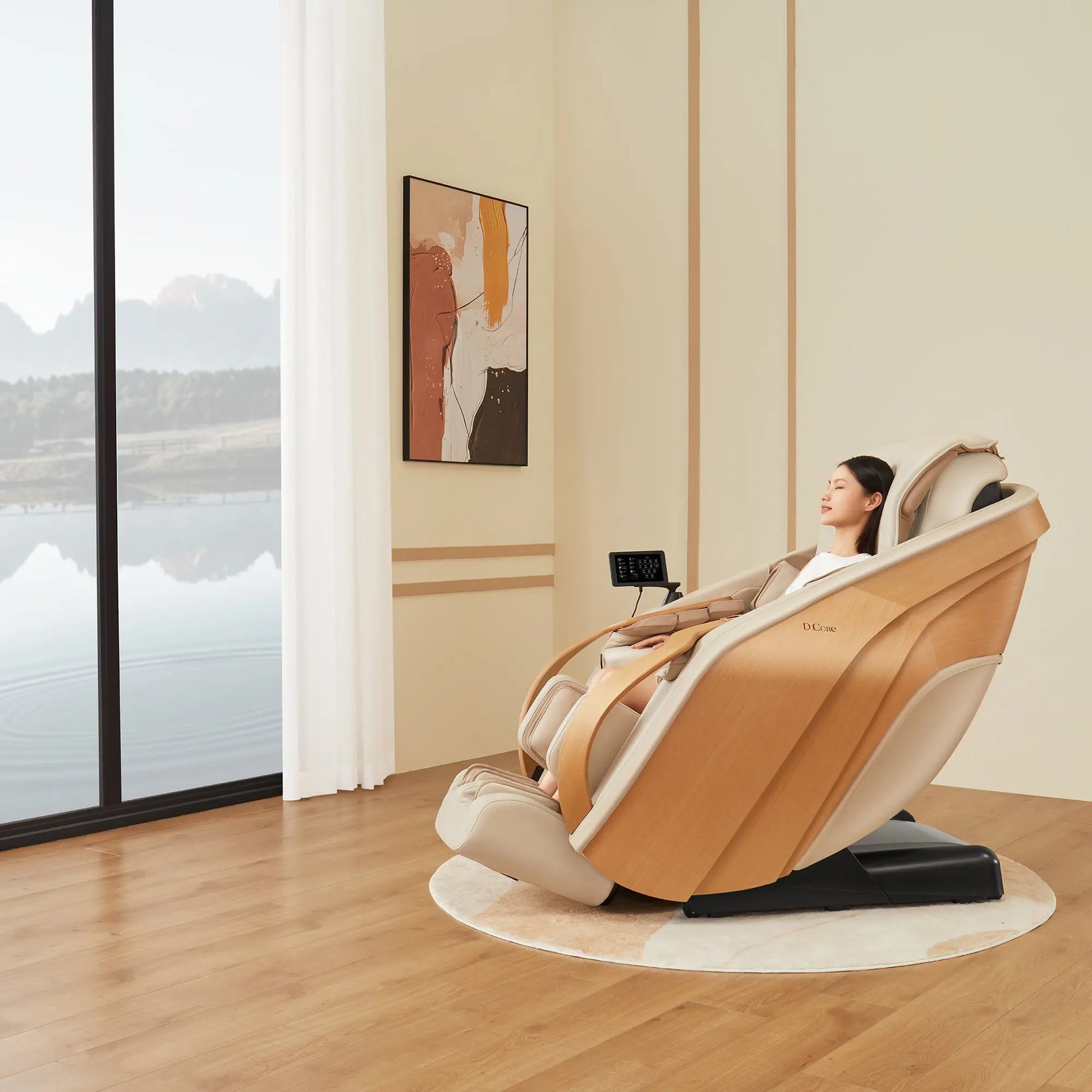 Woman relaxing in a modern massage chair in a room with large windows and a painting on the wall.