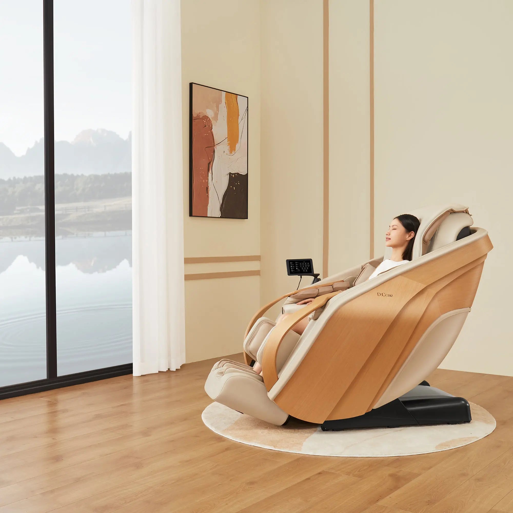 Woman relaxing in a modern massage chair in a room with large windows and a painting on the wall.