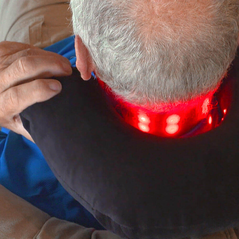 Person wearing a dpl® Light Therapy Neck Pillow