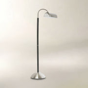 Black and brushed silver floor lamp with a curved adjustable neck and dome-shaped shade.