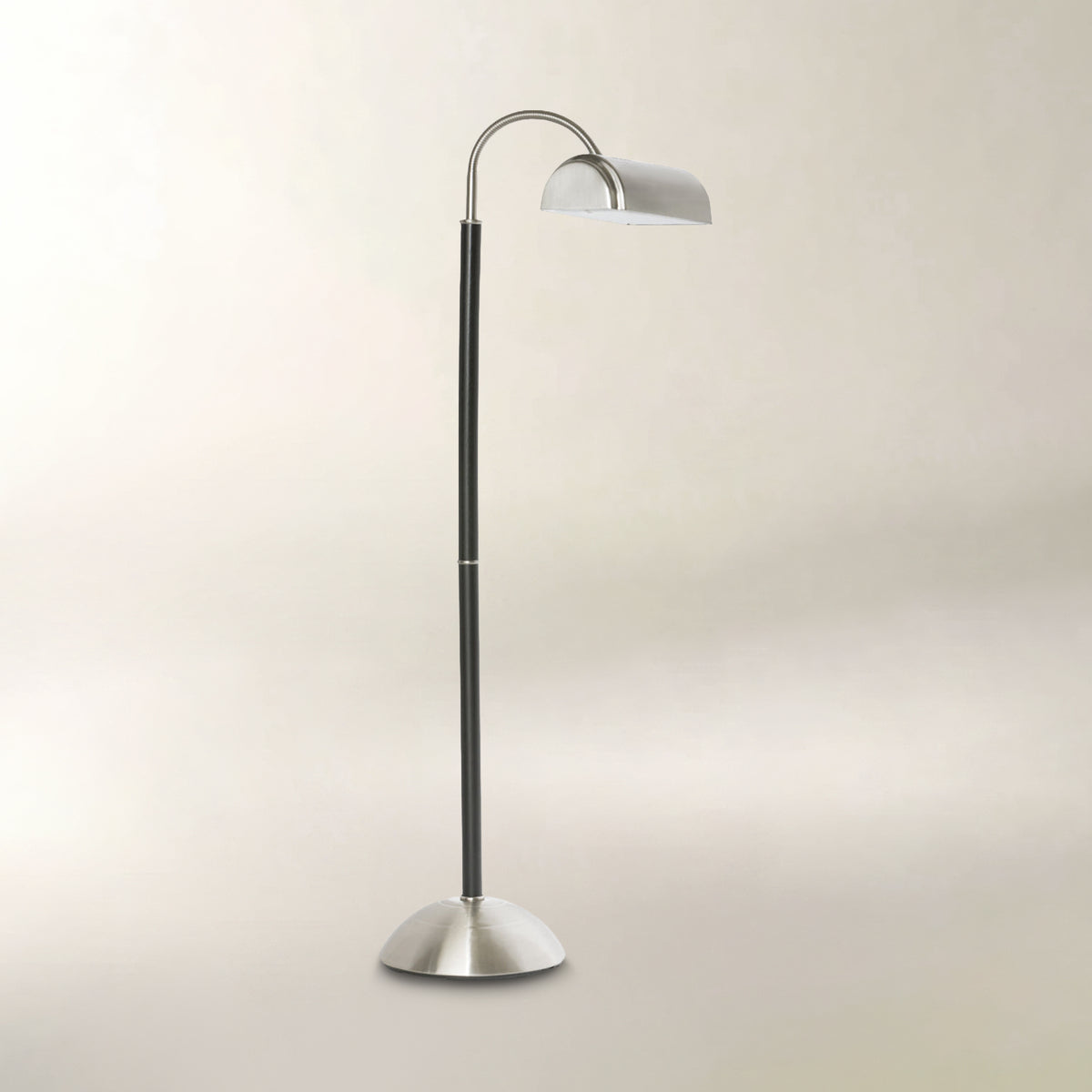 Black and brushed silver floor lamp with a curved adjustable neck and dome-shaped shade.