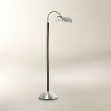 Black and brushed silver floor lamp with a curved adjustable neck and dome-shaped shade.