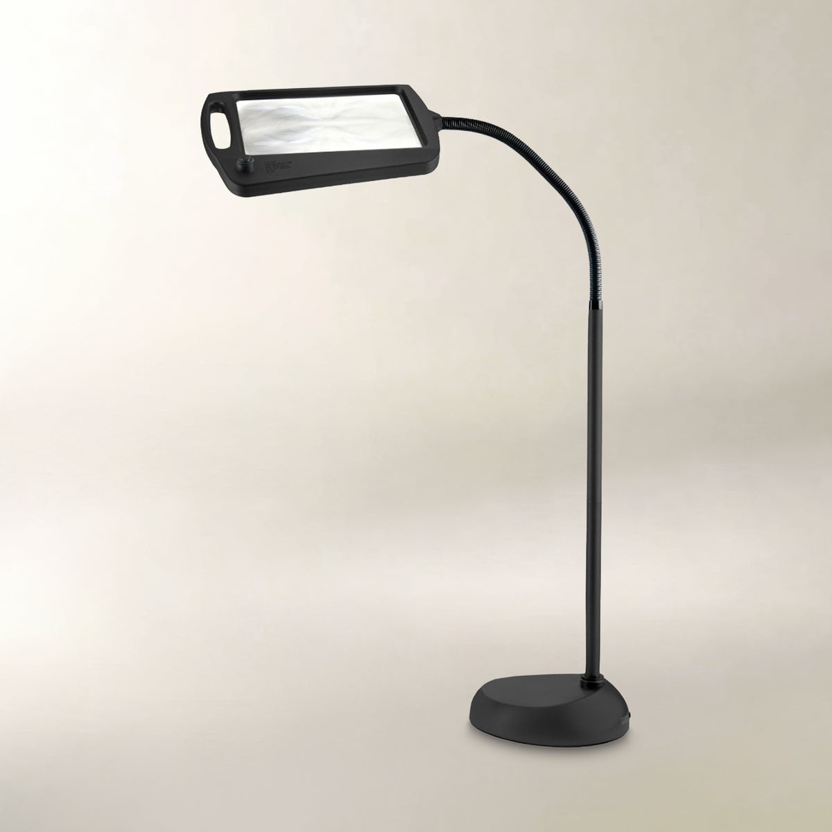 A black magnifying lamp with a flexible gooseneck arm and a rectangular magnifying lens, shown on a plain light beige background.