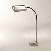 Daylight24 Full Page Magnifying Floor Lamp with a flexible neck and rectangular lens.
