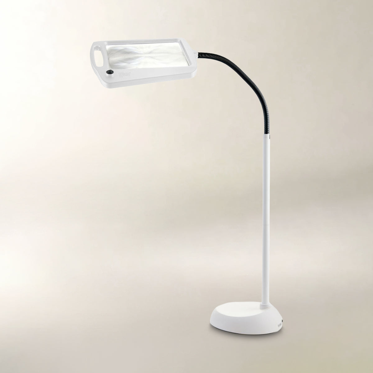A white magnifying lamp with a flexible black gooseneck arm and a round white base, shown against a plain beige background.