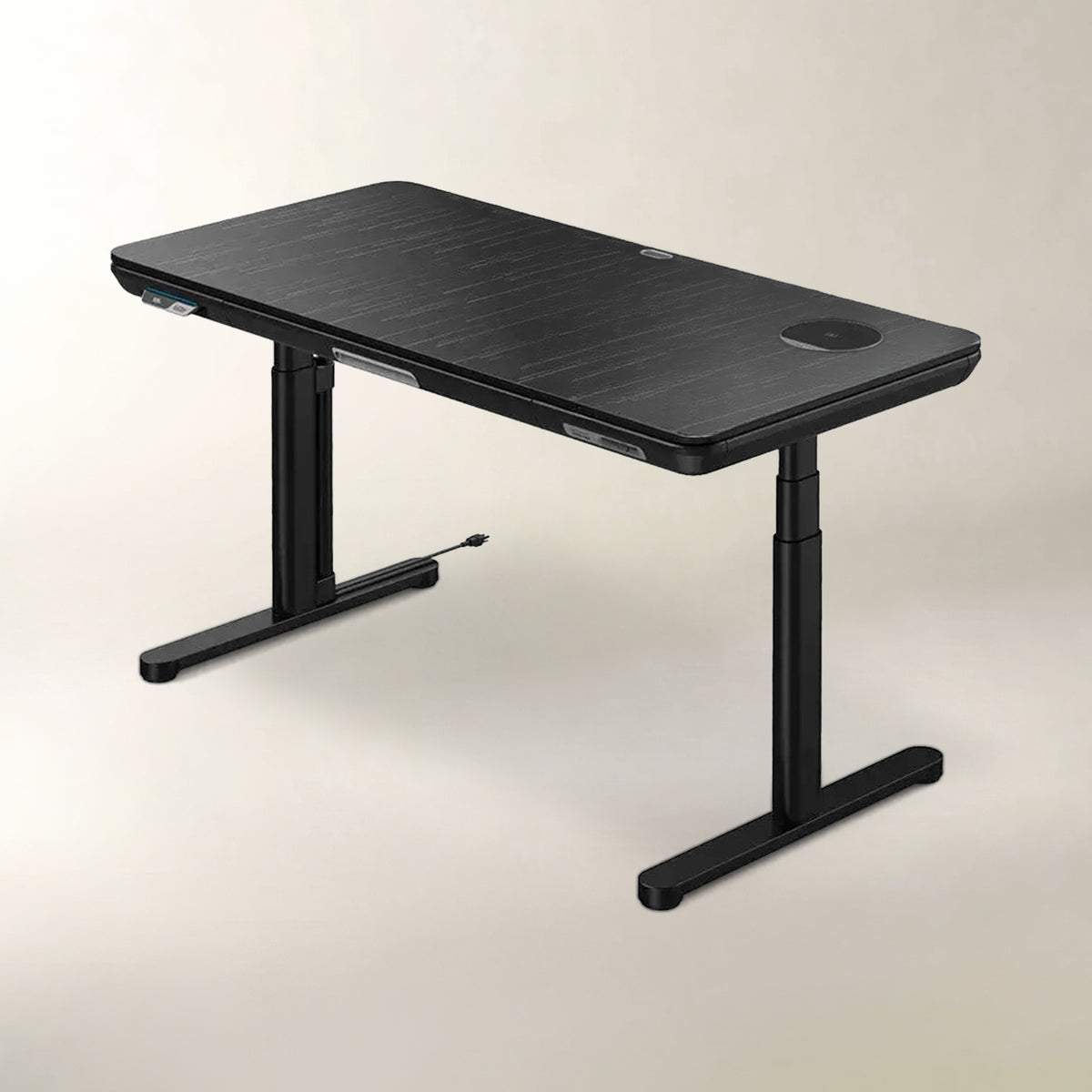 A black adjustable standing desk with a wood-grain textured top, T-style metal legs, and a built-in circular cable management port on the right side, shown against a neutral light beige background.