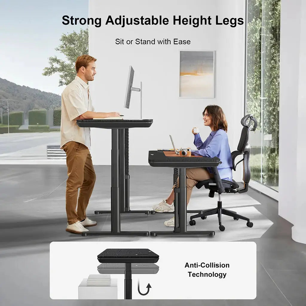 A man stands and a woman sits at matching adjustable desks in a modern workspace, demonstrating sit-stand versatility.