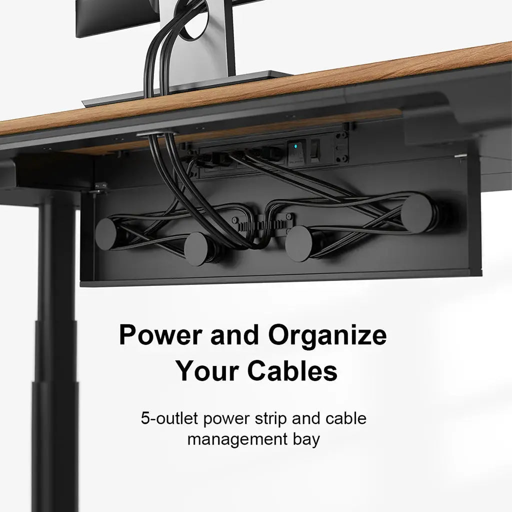 Under-desk view of a cable management bay with organized cords and a built-in power strip.
