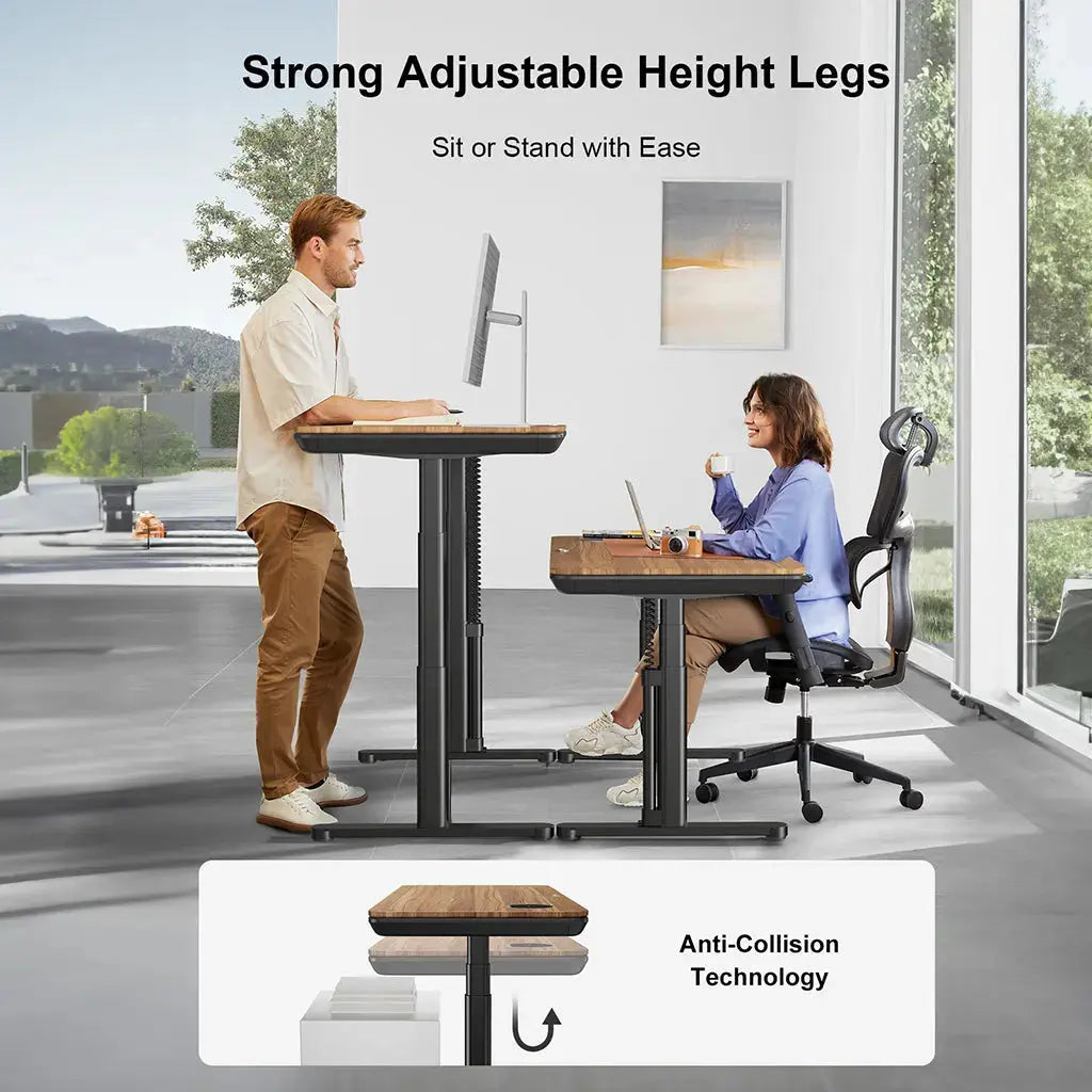 A man stands and a woman sits at matching adjustable desks in a modern workspace, demonstrating sit-stand versatility.