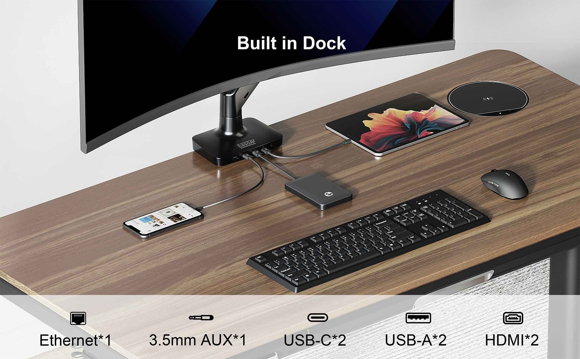 Desk setup with computer monitor, keyboard, mouse, and devices connected to a dock.